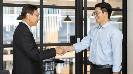 Businessman shaking hands with a lawyer or judge After signing the contract and the agreement is complete, Approval of an agreement between business and law, End of the legal case.