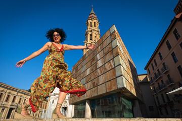 A happy woman smiling in the Plaza del Pilar in Zaragoza.