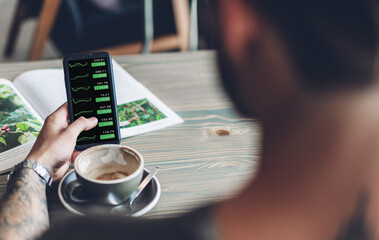 Successful of business trader investor man use technology smartphone trading graph of block chain stock market cryptocurrency investment selling and buy with price chart data graph
