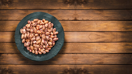Dried pinto beans in the bowl - Phaseolus vulgaris - obrazy, fototapety, plakaty
