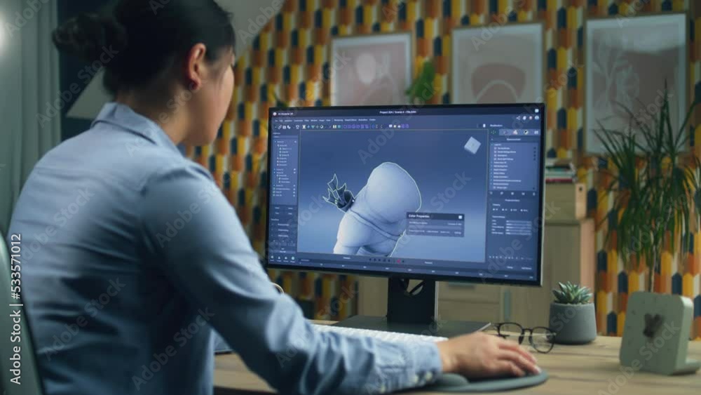 Poster female 3d designer creating and drawing character for video game using computer while sitting at the