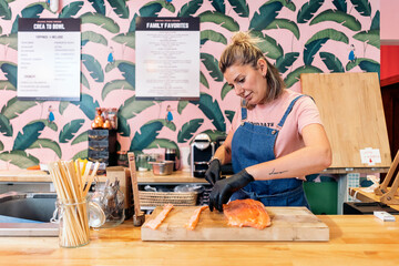 Fototapeta na wymiar Focused Woman Working in Restaurant