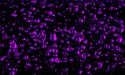 Bubbles close-up on a black background. Oxygen cocktail. Carbonated drink with lots of bright bubbles.
