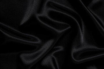 Abstract black background. Black silk satin texture background