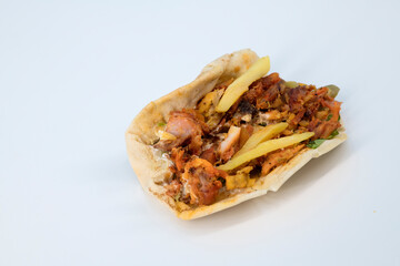 Shawarma sandwich fresh roll of, chicken salad wrap white sauce on white background.Shawarma sandwich-fresh roll of thin pita bread filled with grilled chicken, cabbage, carrots, sauce, green. 
