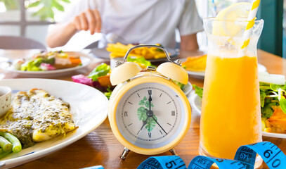 Intermittent fasting with  yellow Alarm clock