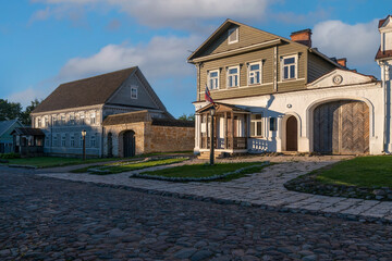 View of historical merchant buildings of estates on the main street of Izborsk Pechorskaya Street...