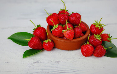 Fresh organic strawberries , over white background. Vegetarian healthy food concept.