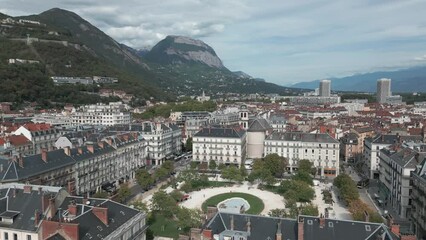 Flying counter clockwise around Place Victor Hugo in Grenoble France