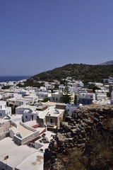 Fototapeta na wymiar White houses with blue shutters, balconies, the traditional Greek village of Mandraki on the island of Nisyros.