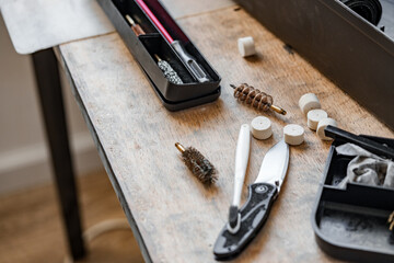 Set of tools for cleaning and repairing weapons in workshop