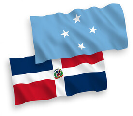 National vector fabric wave flags of Federated States of Micronesia and Dominican Republic isolated on white background. 1 to 2 proportion.