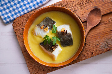 Bacalao al pil pil traditional tapa from the north of Spain. Coconut fish cooked with a delicious...
