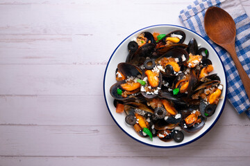 Steamed mussels with tomato sauce and feta cheese. Typical Greek recipe.