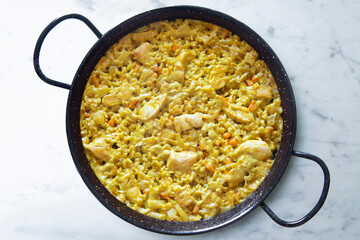 Paella with vegetables and chicken. Typical Spanish tapas recipe.