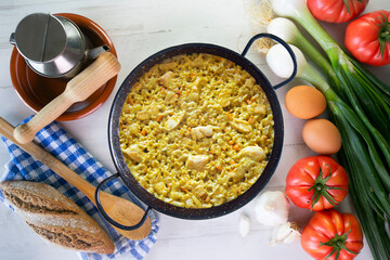 Paella with vegetables and chicken. Typical Spanish tapas recipe.