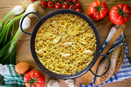 Paella with vegetables and chicken. Typical Spanish tapas recipe.