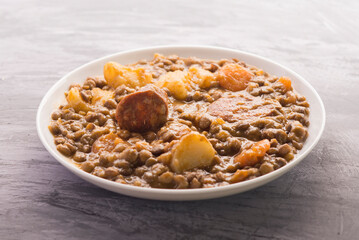 Spanish lentils with potatoes, carrot and chorizo