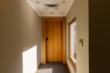 Interior of a hotel corridor with doors with room nummbers