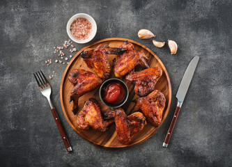 Grilled spicy chicken wings with ketchup. Spicy Homemade Buffalo Wings.