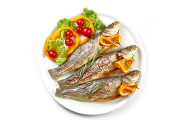 Fresh marinated in spices trout fish in a white plate. White background, selective focus