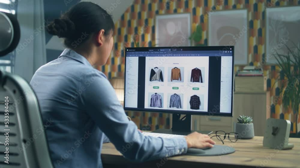 Poster Female asian web designer using personal computer for creating website in professional program while working on project remotely at home. Freelance
