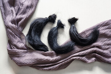 Locks of hair and head scarf
