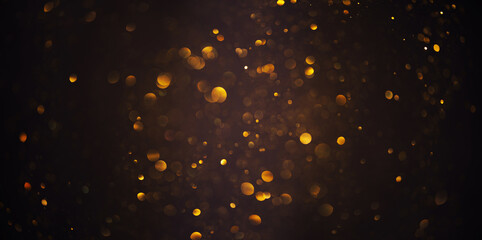 Shiny warm glowing golden glitter festive lights abstract bokeh dark background