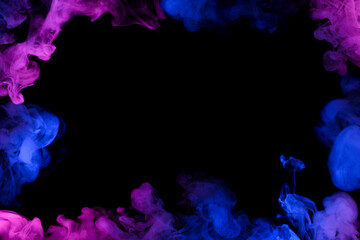 Flowing clouds of neon smoke frame with copy-space in center dark abstract background