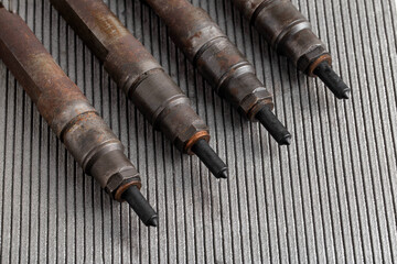 Mechanical injectors from a diesel engine, close-up. Fuel atomization, diesel fuel quality. Close-up, copy space for text