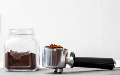 Jar with coffee and a coffee maker on a white background, isolate. Copy space for text, traditional