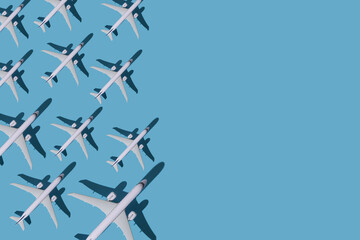 Airplane background. Flights, travel and aviation. Pattern of white planes on a blue background....