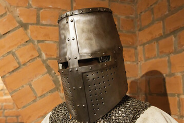 Protective old topfhelm helmet from the 14th century used in Europe, close-up. 14th century