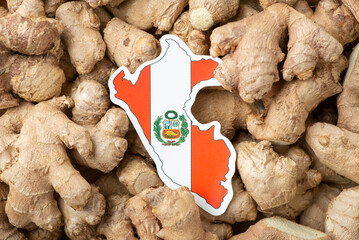 Flag of Peru on ginger roots background. Origin of ginger is Peru, growing ginger in Peru concept