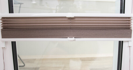 Modern classic aluminum blinds on the window sash with a scaffold fixing system. Protection from...