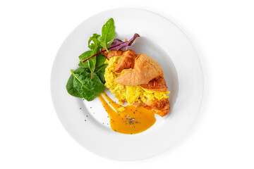 Sandwich with egg, tomatoes and ham in a croissant. Balanced, nutritious, tasty and nutritious food. Ready-made menu for a restaurant or for delivery. Isolated on a white backgrou
