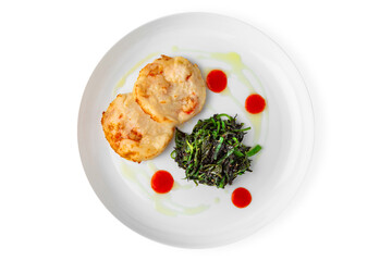 Fish cutlets with shrimps and chukka. Balanced, nutritious, tasty and nutritious food. Ready-made menu for a restaurant or for delivery. Dish in a white plate isolated on a white background.