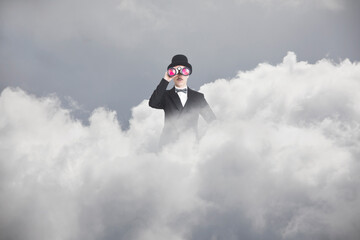 surreal businessman with spyglass comes out of a cloud to scan the future