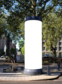empty advertising pillar in a city with free copy space, promotion mockup