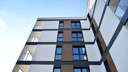 Modern luxury residential flat. Modern apartment building on a sunny day. Apartment building with a blue sky. Facade of a modern apartment building.