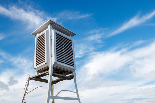 Meteorological or psychrometric booth on a background of clouds.