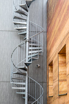 Metal, industrial spiral staircase. Emergency and fire exit