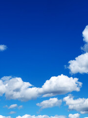 Blue sky with clouds background. Bright blue sky in summer.