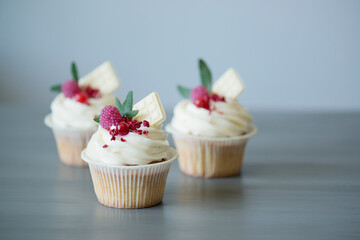 Baking cupcakes with cream on the table