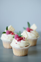 Baking cupcakes with cream on the table