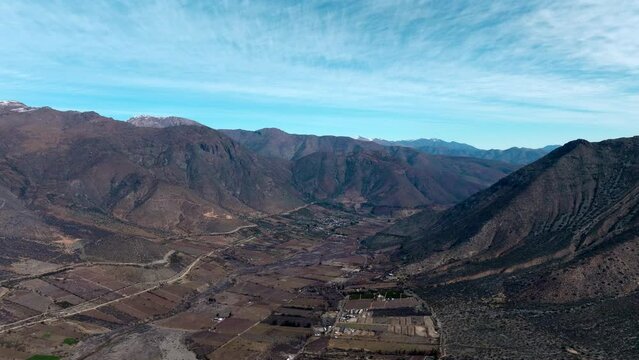 Panoramic aerial view of arid mountains of northern Chile on a sunny day.