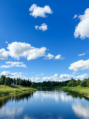 Beautiful natural scenery of river and blue sky in Moscow region, Russia. Summer landscape.