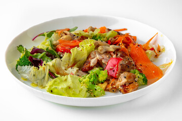 Salad of vegetables and nuts. Balanced, nutritious, tasty and nutritious food. Ready-made menu for a restaurant or for delivery. Dish in a white plate isolated on a white background.