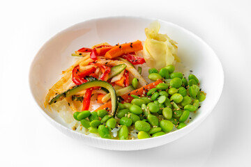 White rice with beans and cooked vegetables. Balanced, nutritious, tasty and nutritious food. Ready-made menu for a restaurant or for delivery. Dish in a white plate isolated on a white background.