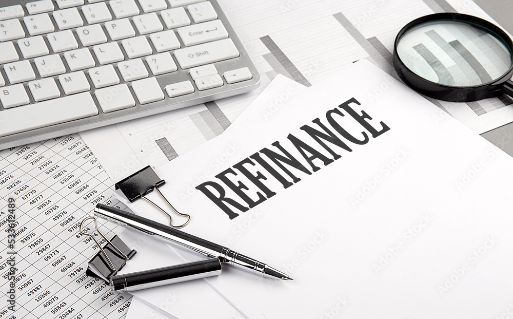 Poster refinance text on paper with chart and keyboard, business concept